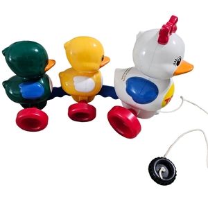 Vintage Tomy family ducks pull along, 1995